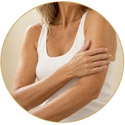 Woman touching her upper arm and elbow